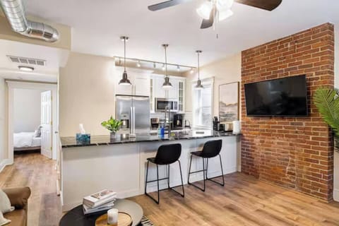 The heart of the home—featuring a modern kitchen, comfortable seating, and a warm atmosphere for making memories together.