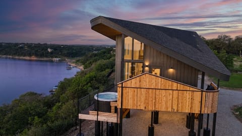 Modern lakeview cabin with hot tub, big windows, and epic sunsets