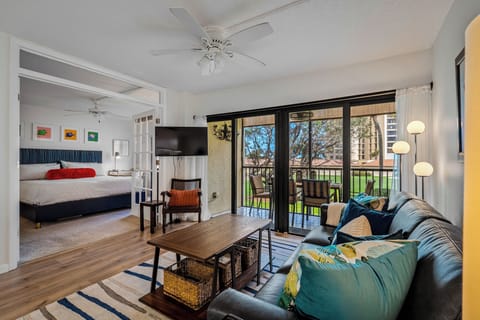 Living room into bedroom and lanai overlooking the first hole of the golf course