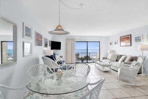 Bright living room with ocean views and cozy seating