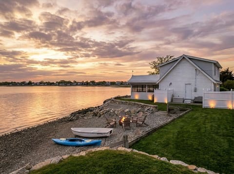 Waterfront sunset retreat with private beach, fire pit, and kayaks