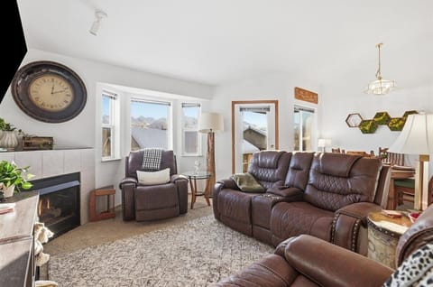 Bright open-concept living area with vaulted ceilings and abundant natural light.