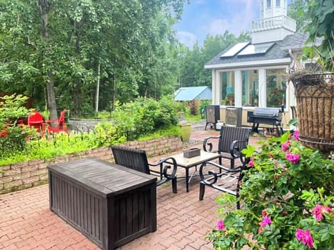 Spacious brick patio with comfortable lounge seating