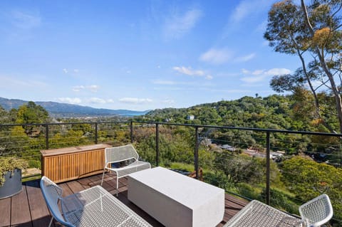 Upper outside deck offers breathless views of the city, mountains and ocean below.