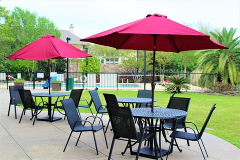 Outdoor tables with umbrellas for alfresco gatherings.