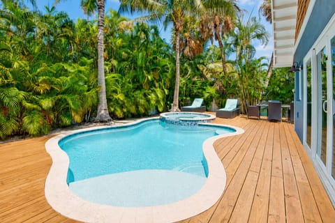 Private tropical pool & spa oasis with lush landscaping