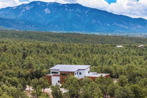 Modern home tucked into forest below the Sangre de Cristos
