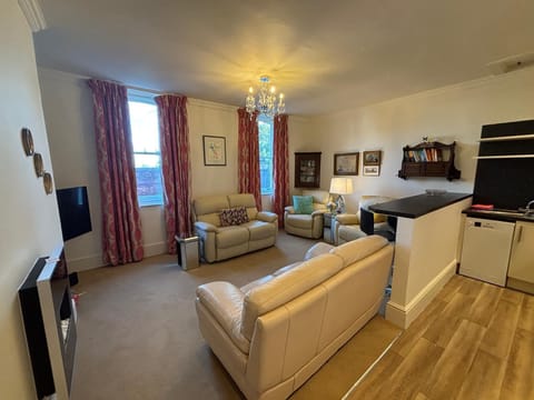 A spacious lounge with fully equipped kitchen and Smart TV and seating for 6 persons if you have guests