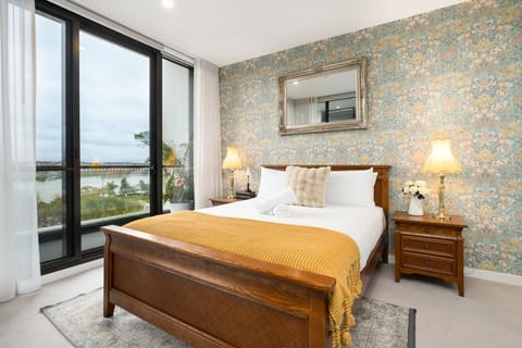 Enjoy beautiful natural light and lovely views from this inviting bedroom, offering the perfect place to recharge.