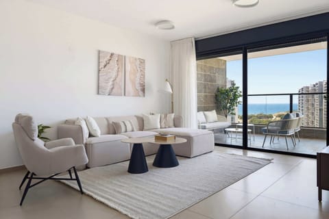 Sunlight floods this expansive lounge space, seamlessly connecting your peaceful indoor relaxation with ocean panoramas.