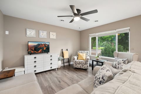 Unwind in your peaceful living space where neutral tones and natural light create the perfect retreat. Sink into comfortable seating and enjoy garden views from the window.