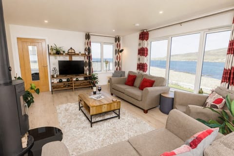 Living area with large windows and sea views