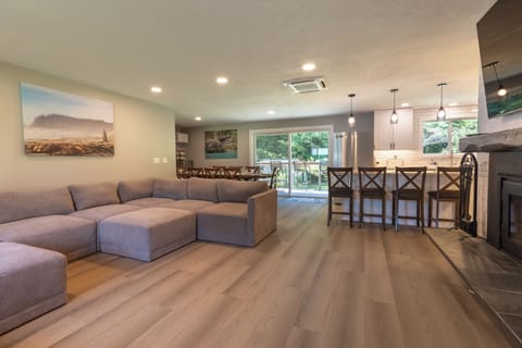 Open flow from the living room into the kitchen and large dining area.
