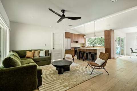 Bright open living space with designer kitchen and spacious island seating