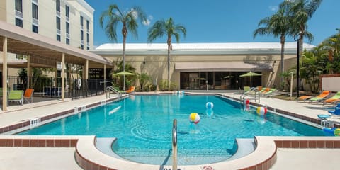 Dive into sunshine and relax beside the sparkling pool.