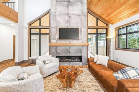 Sink into the sofa and enjoy the warmth of the fireplace.