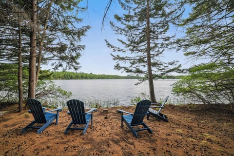 Welcome to your back yard! Private lakeside Adirondack seating with serene views