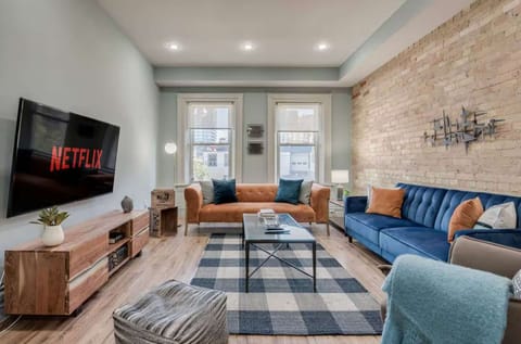 Modern Furnished Living Room with Brick Wall