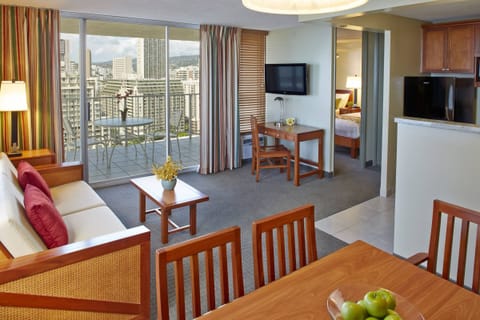 Step onto the balcony and savor sparkling city skyline views.