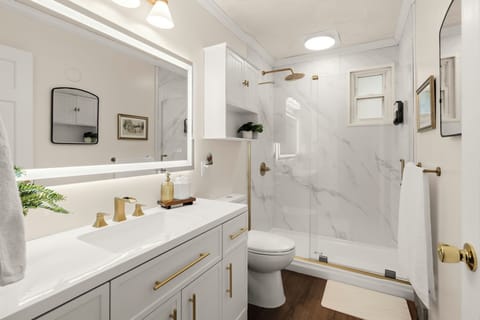 Unwind in our newly renovated, spa-inspired bathroom featuring modern fixtures and a fresh, tranquil design.