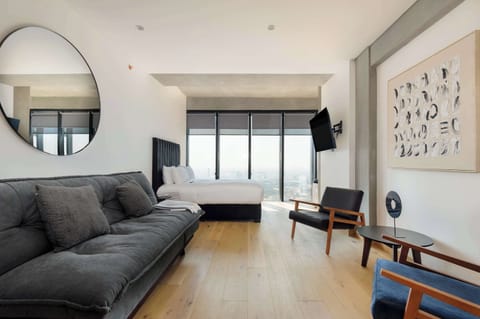 Bright open-concept space with elegant finishes and large windows that flood the room with natural light.
