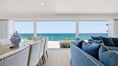 Open-plan living and dining with stunning ocean views.