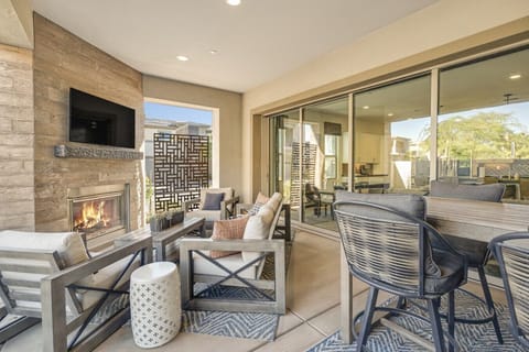 Back Patio with fireplace, Smart TV and outdoor seating