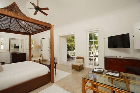 Relax beneath the romantic canopy bed in a breezy retreat