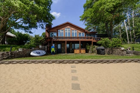 Your own slice of private sand beach in White Sand Lake — steps from the door, ready for morning coffee or evening bonfires.