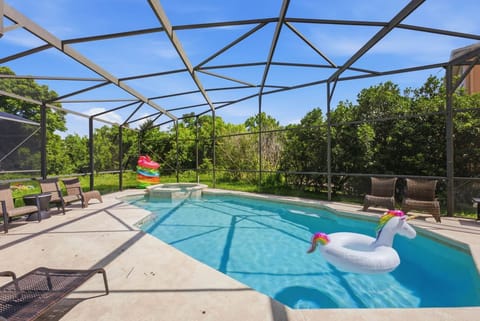 A hot tub is attached to the pool