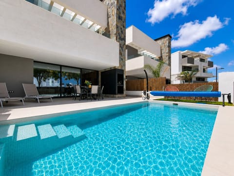 Luxury three-bedroom villa at Santa Rosalía Lake & Life Resort with private pool, elegant terraces and lagoon views.