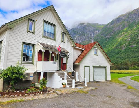 Exterior and entrance. Private parking area immediately in front of the house