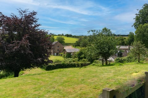 Enjoy panoramic countryside views across the 8-acre grounds at Old Mill Cottages.