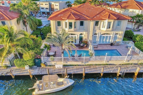 Private waterfront retreat with a pool, dock, and resort-style outdoor living