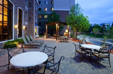Gather around the fire pit on the outdoor patio as the sun goes down