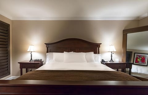 Unwind into crisp linens under warm bedside lighting.