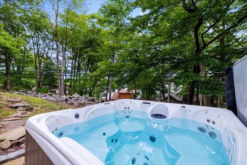 Slip into the 7-person hot tub and unwind beneath the trees year-round.