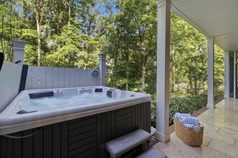  Your own private soak — the covered hot tub sits tucked among the trees, ready whenever you need to unwind.
