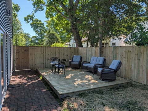 OVERVIEW: The cute fenced-in backyard with plenty of seating. Fun and relaxing times found here!