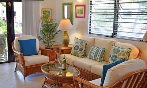 Sip wine and relax into cushioned wicker seating after beach days.