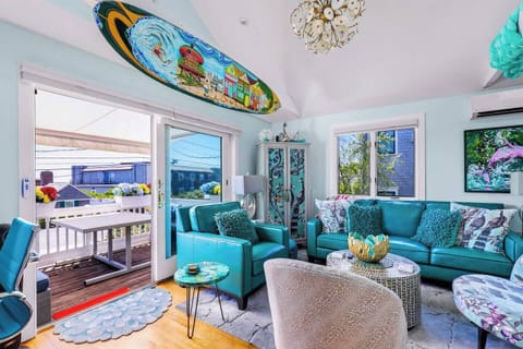 Relax in a bright, cozy living space after a day at the beach