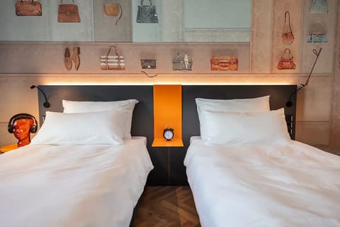 Sink into peaceful sleep in a bright, stylish twin room.