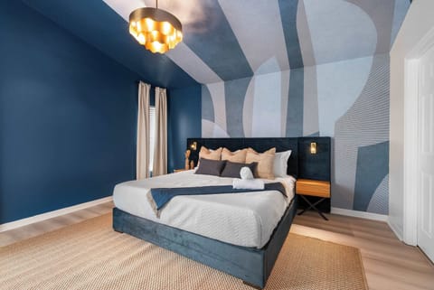 Drift into comfort in this stylish retreat, where bold blue tones and modern design create a calming atmosphere. Perfect for relaxing after a day of adventure with family and friends. 💙✨