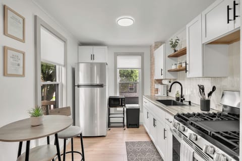 Remodeled kitchen with gas stove/oven, full refrigerator. Stocked with dry goods, kitchen essentials and cleaning supplies.