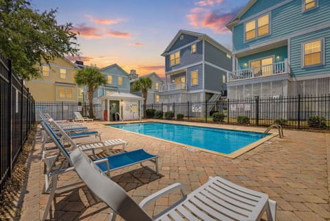 Enjoy lazy afternoons by the complex pool and stunning coastal sunsets.