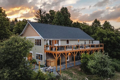 Spacious woodland retreat with a sunset-view deck and cozy outdoor spaces
