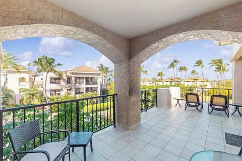 Covered Arched Balcony with Seating & Resort Views 
