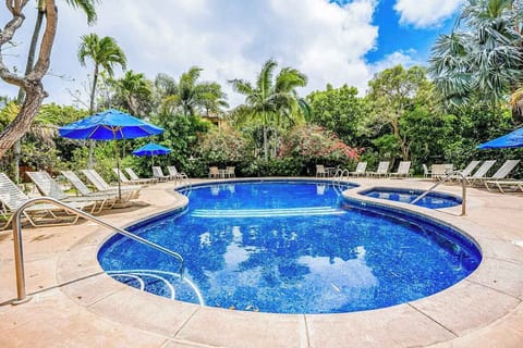 Sparkling Resort Pool Surrounded By Palms