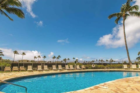  Relax poolside surrounded by tropical landscaping