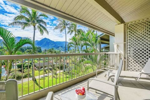 Relax on the balcony surrounded by lush tropical island greenery